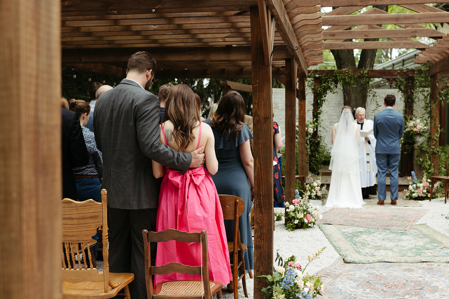 Couple watches wedding ceremony at Iron Amethyst Inn