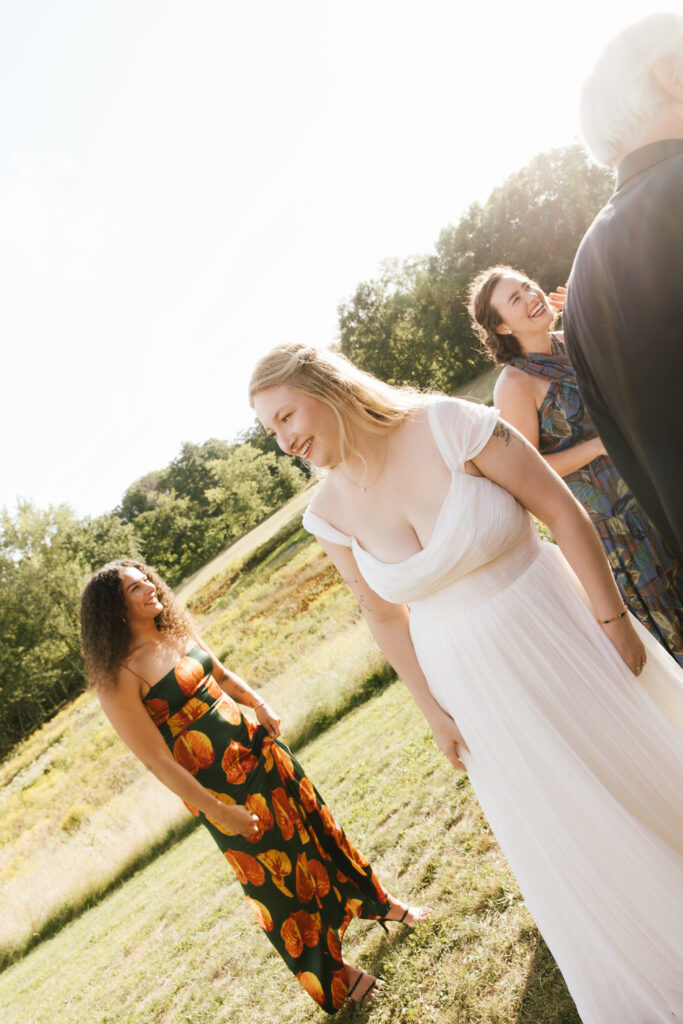 Bride between family photographs on her wedding day