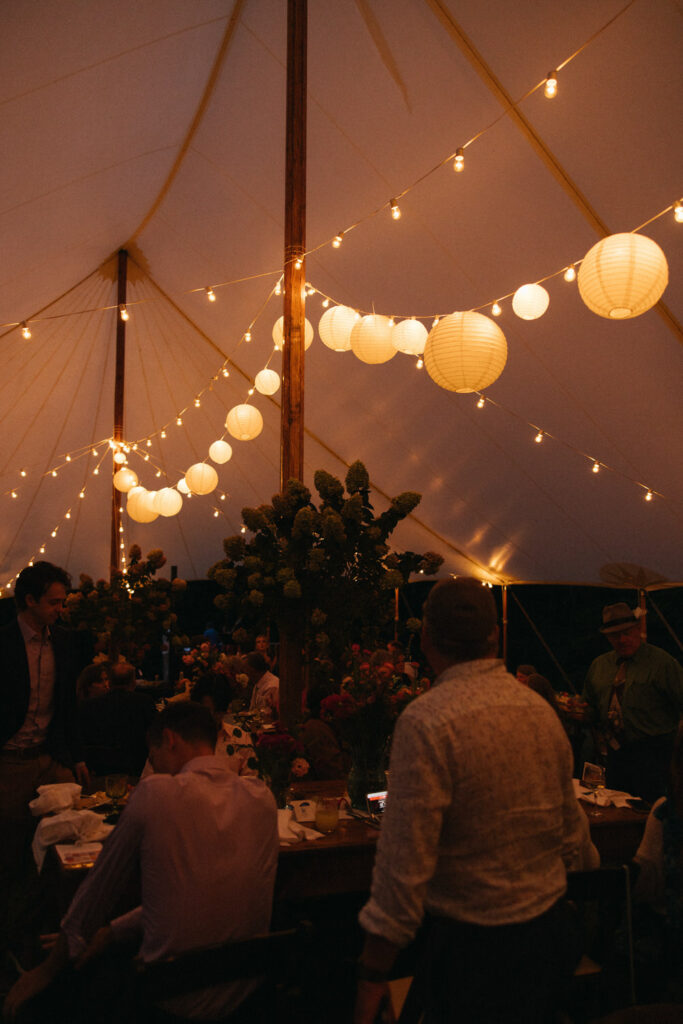 Rice paper lamps add to the ambiance of this tented wedding in Saco Maine