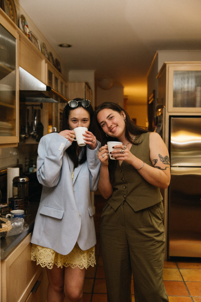 Wedding guests load up on coffee in the bride's families kitchen between songs