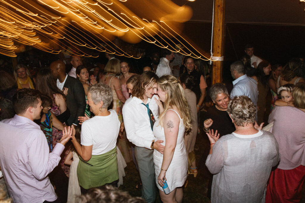 Couple dances among friends and family at their wedding in Saco Maine